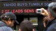  A news headline about the Tumblr sale to Yahoo scrolls on a building in New York's Times Square, May 20, 2013.