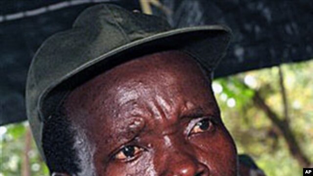 The leader of the Lord's Resistance Army, Joseph Kony, answers journalists' questions following a meeting with UN officials in southern Sudan, Nov 2006 (file photo)