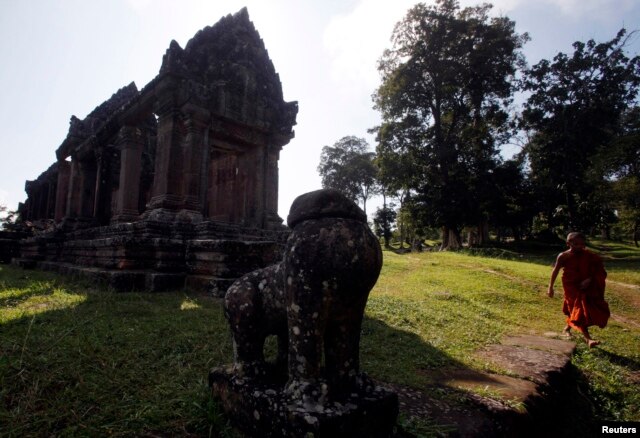 FILE - A Buddhist monk visits the Preah Vihear temple on the border between Thailand and Cambodia, Nov. 12, 2013.