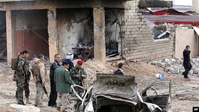 Iraqi security forces inspect scene of the attack near Mosul, Jan. 16, 2012.
