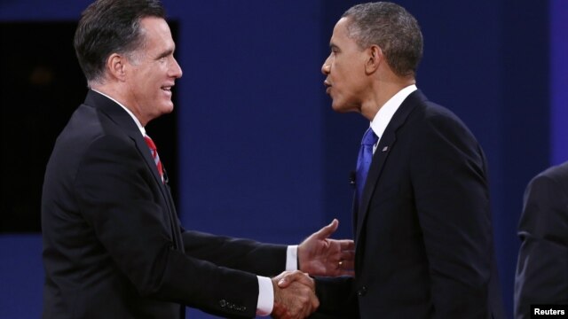 U.S. President Barack Obama (R) and Republican Presidential nominee Mitt Romney shake hands at the conclusion of the final presidential debate at Lynn University in Boca Raton, Florida October 22, 2012. 
