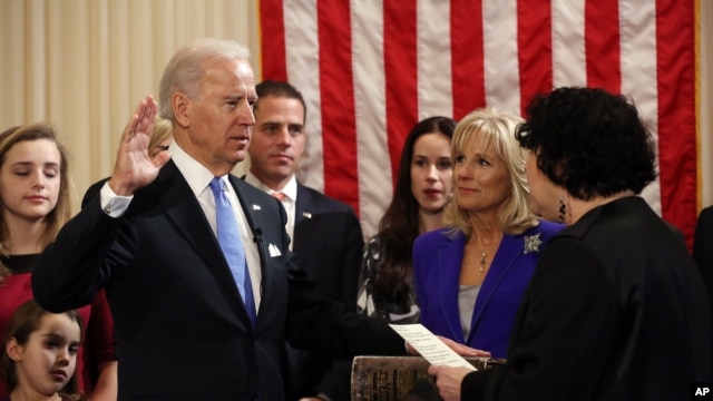 Vice President Joseph Biden, Jr. takes the oath of office, administered by Associate Supreme Court Justice Sonia Sotomayor in the residence of the vice president in Washington, January 20, 2012.