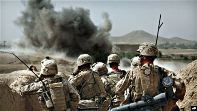 United States Marines watch the explosion after calling in an air strike to clear the area of insurgents near Musa Qaleh, southern Afghanistan (file photo – 23 Jul 2010)