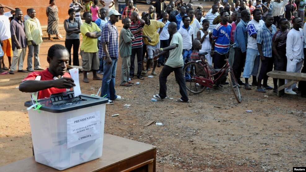 FILE - A man casts his vote at a polling station during presidential elections in Accra, Ghana, Dec. 7, 2012.