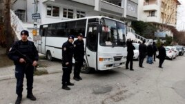 Riot police stand guard in front of a labor union office in Ankara, February 19, 2013. Police launched raids across Turkey early Tuesday targeting a militant leftist group behind a suicide bomb attack on the U.S. embassy.