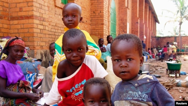Internally displaced children, who are escaping the violence, pose at Bangui's Saint Paul's Church December 17, 2013. Some European countries will send troops to support a French-African mission to restore order in Central African Republic, French Foreign