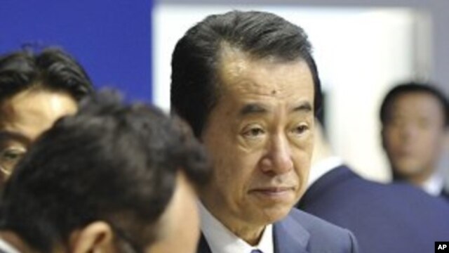 Japanese Prime Minister Naoto Kan, right, participates in a meeting at the G8 summit in Deauville, France, Thursday, May 26, 2011