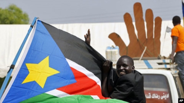 A Sudanese man cheers during a demonstration in support of the referendum on southern independence during a rally organized by the Southern Sudan Referendum Bureau in Juba, 07 Jan 2011.