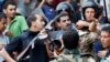 Egyptian Forces Raid Mosque; Fresh Protests in Cairo
