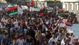 Protesters chant slogans against armed militias during a march in Benghazi city, September 21, 2012.