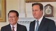 英首相卡梅伦(右)在伦敦会晤到访的中共政治局常委李长春