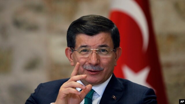 FILE - Turkish Prime Minister Ahmet Davutoglu speaks to a group of foreign reporters in Istanbul, Turkey, Dec. 9, 2015. 