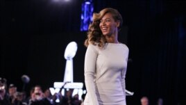 Recording artist Beyonce walks offstage after the halftime show press conference ahead of the NFL's Super Bowl XLVII in New Orleans, Louisiana, Jan. 31, 2013.
