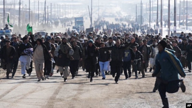 Afghan demonstrators run as they shout anti-US slogans during a protest against Koran desecration in Kabul, February 23, 2012.