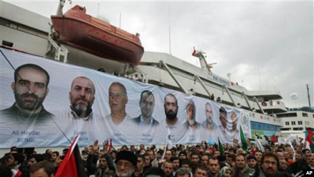 A banner depicting the faces of the nine men killed, displayed on the Mavi Marmara ship, the lead boat of a flotilla headed to the Gaza Strip which was stormed by Israeli naval commandos in a predawn confrontation in the Mediterranean May 31, 2010, on its