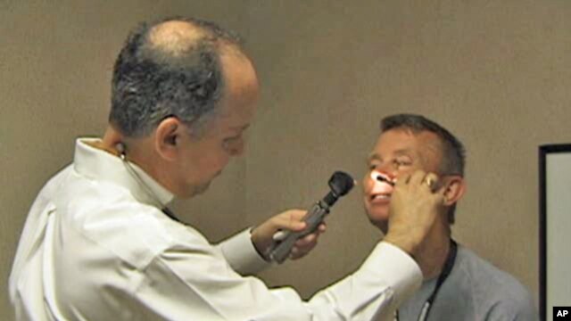 Allergist Burt Wolf (left) blames global warming for the increased pollen that aggravates allergy sufferers.