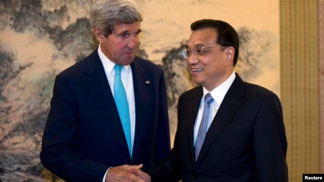 Джон Керри и Ли Кегъянг