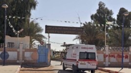 An ambulance enters an hospital located near the gas plant where hostages have been kidnapped by Islamic militants, in Ain Amenas, January 19, 2013.