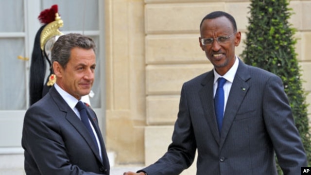 France's President Nicolas Sarkozy (L) welcomes his Rwandan counterpart Paul Kagame as he arrives at the Elysee palace in Paris, September 12, 2011.