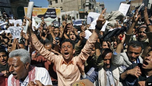 Yemeni anti-government protesters shout slogans during a demonstration demanding the resignation of President Ali Abdullah Saleh, in Sana'a, February 15, 2011