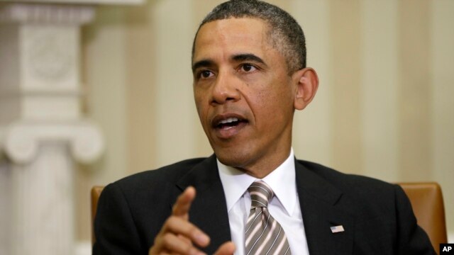 President Barack Obama answers a question from a reporter during his meeting with Japan's Prime Minister Shinzo Abe at the White House, Feb. 22, 2013. 
