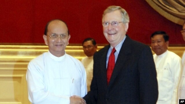 President Thein Sein, left, welcomes U.S. Senate Republican leader Mitch McConnell at the presidential palace Tuesday, Jan. 17, 2012 in Naypyitaw, Myanmar.