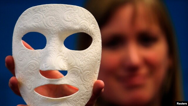 Vanessa Palsenbarg, Corporate Communications Specialist at Materialise, shows a 3D model called Burn Mask, a customized mask for facial scar management at the company's headquarters in Leuven, January 24, 2013.