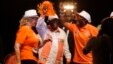 Ivory Coast incumbent President Alassane Ouattara, center, dances  with his wife Dominique Ouattara, left,  during his election rally  in Abidjan, Ivory Coast, Oct. 23, 2015.