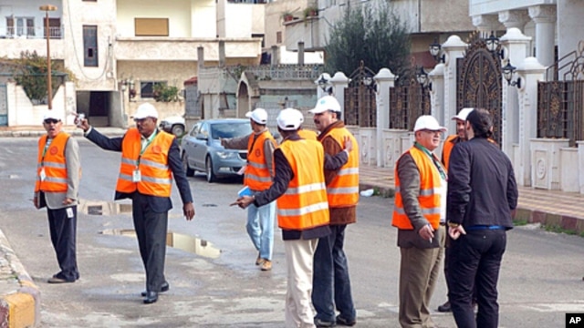 Arab League monitors check Al-Sabil area, in Daraa, Syria, January 3, 2012.