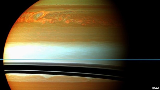 These red, orange and green clouds (false color) in Saturn's northern hemisphere indicate the tail end of a massive storm that started in December 2010. 