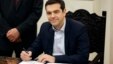 Greece's Prime Minister Alexis Tsipras poses for the photographers after taking a secular oath at the Presidential Palace in Athens, Jan. 26, 2015.