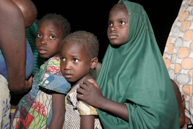 FILE - Children rescued by Nigeria soldiers from captivity from Islamist extremists at Sambisa forest arrive at a camp in Yola, Nigeria, May 2, 2015.