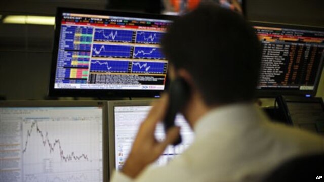 A Portuguese broker talks on the phone in Lisbon, 30 Nov 2010