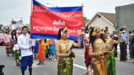 Cambodian traditional dancers give blessing during an annual parade in the designated 'Cambodia Town' section of Long Beach, California, on April 2, 2011, to celebrate Khmer New Year.