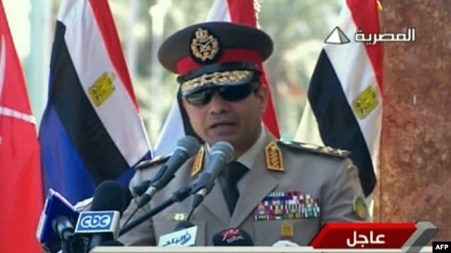 FILE - An image grab taken from Egyptian state TV shows Egypt's army chief General Abdel Fattah al-Sisi giving a live broadcast calling for public rallies  to give him a mandate to fight "terrorism and violence." 