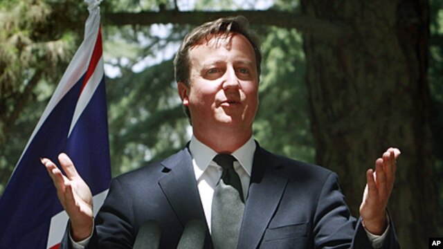 British Prime Minister David Cameron speaks during a joint press conference, with Afghan President Hamid Karzai, unseen, at the presidential palace in Kabul, Afghanistan, July 5, 2011