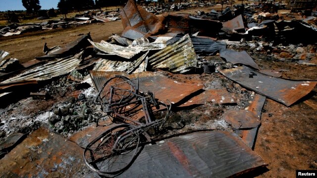 A bicycle lies amongst the debris of houses destroyed in post election violence in the village of Rukuini near Eldoret, northwest of Nairobi, Kenya, Jan. 7, 2008. 