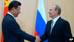 Си Цзиньпин и Владимир Путин. Уфа, Россия, 8 июля 2015.
