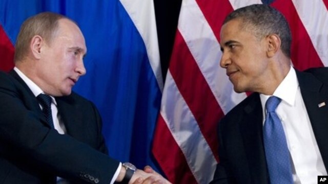 President Barack Obama shakes hands with Russian President Vladimir Putin, G20 Summit, Los Cabos, Mexico, June 18, 2012.