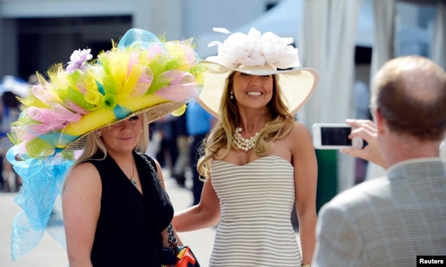 The Kentucky Derby is a BIG deal in Kentucky. People usually dress up to wathch the famous horse race. Women wear big, beautiful hats. May 3, 2014 (Jamie Rhodes-USA TODAY Sports)