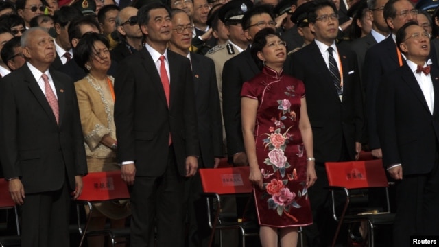 Former Hong Kong Chief Executives Tung Chee-hwa (front L), Donald Tsang (front R), new Hong Kong Chief Executive Leung Chun-ying (front 2nd L), his wife during a ceremony in Hong Kong, July 1, 2012.