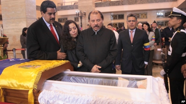 President Daniel Ortega and his wife Rosa Murillo mourn Hugo Chavez.