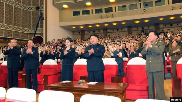 North Korean leader Kim Jong Un (Center) applauds during a demonstration performance by the newly formed Moranbong band in Pyongyang, July 9, 2012
