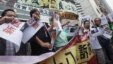 Pro-democracy lawmaker Lee Cheuk-yan (2nd L) and other protesters call for release of political prisoners, in Hong Kong. 