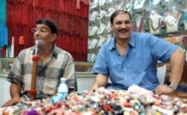Essam Rashad, left, happily back on his sheesha pipe after a day of abstaining.