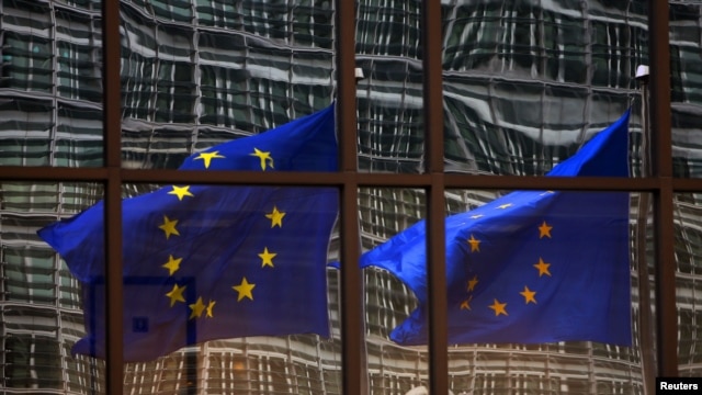 A European flag reflects in a building of the EU headquarters in Brussels. (File)