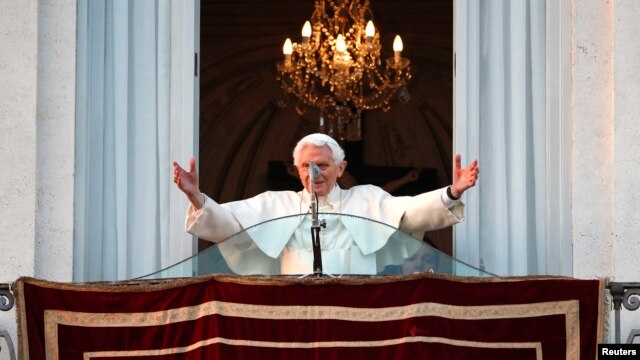 Pope Benedict waves to the faithful from the balcony of his summer residence in Castel Gandolfo, Feb. 28, 2013. 