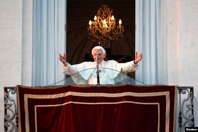 Pope Benedict waves to the faithful from the balcony of his summer residence in Castel Gandolfo, Feb. 28, 2013.