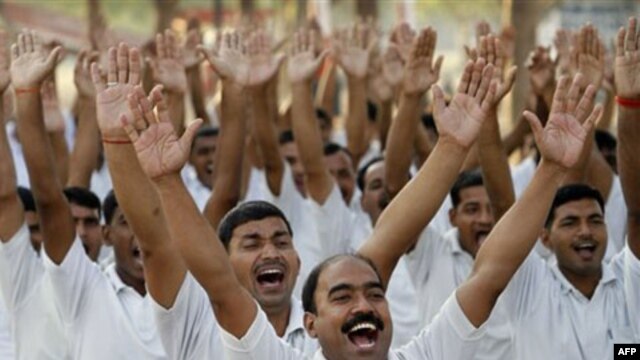 Fear or therapy?  Policemen practice laughter therapy in Allahabad, India, in this file photo. 
