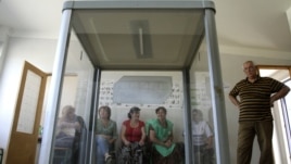 Election commission officials prepare a polling station on the eve of the parliamentary election in Tbilisi, September 30, 2012.